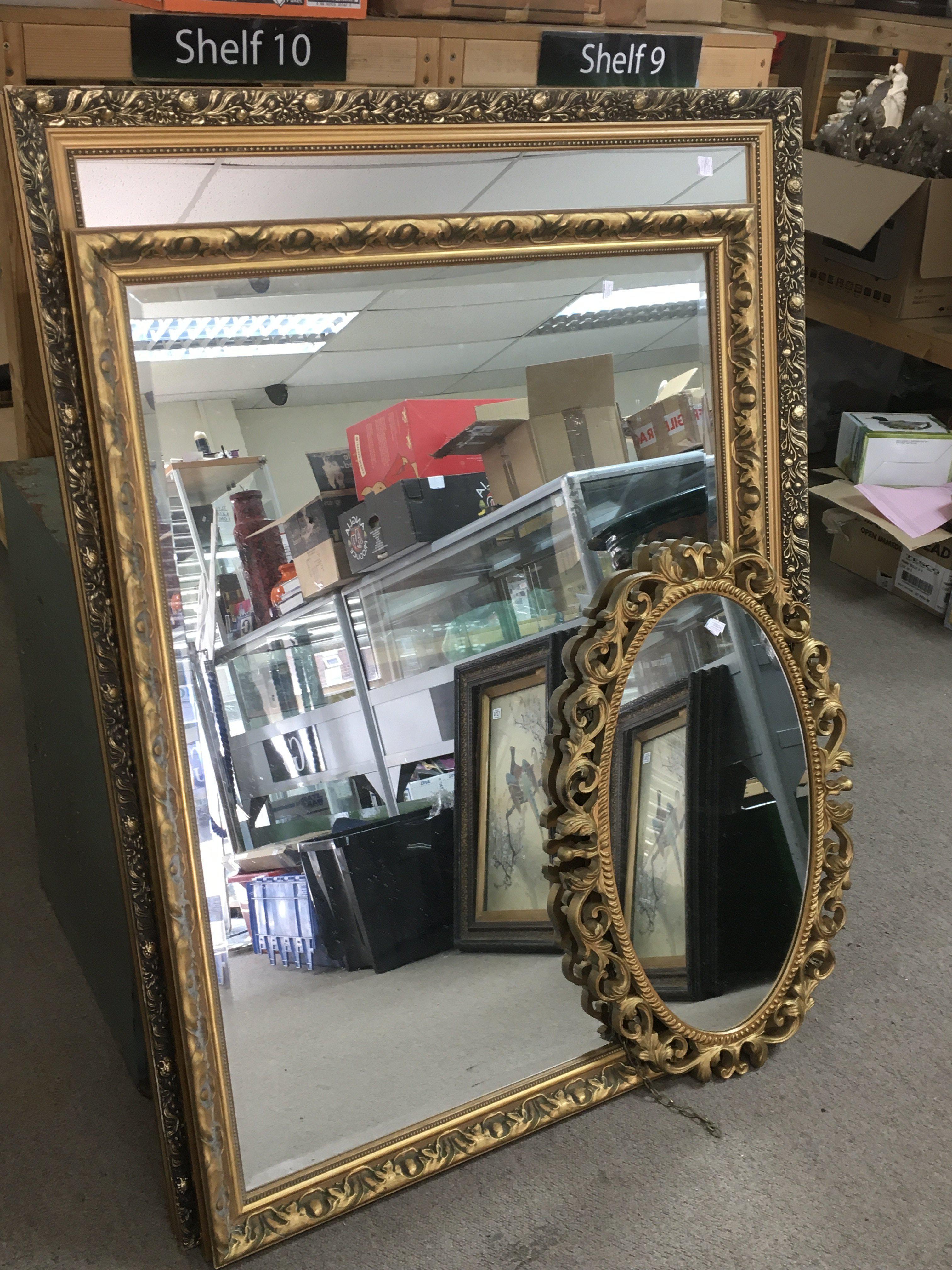 Three gilt framed mirrors, the largest measuring 9