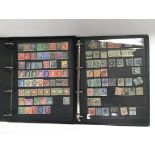 Seven albums of world postage stamps.