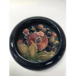 A small moorcroft swallow bowl decorated with pomegranate design. 10 cm - NO RESERVE