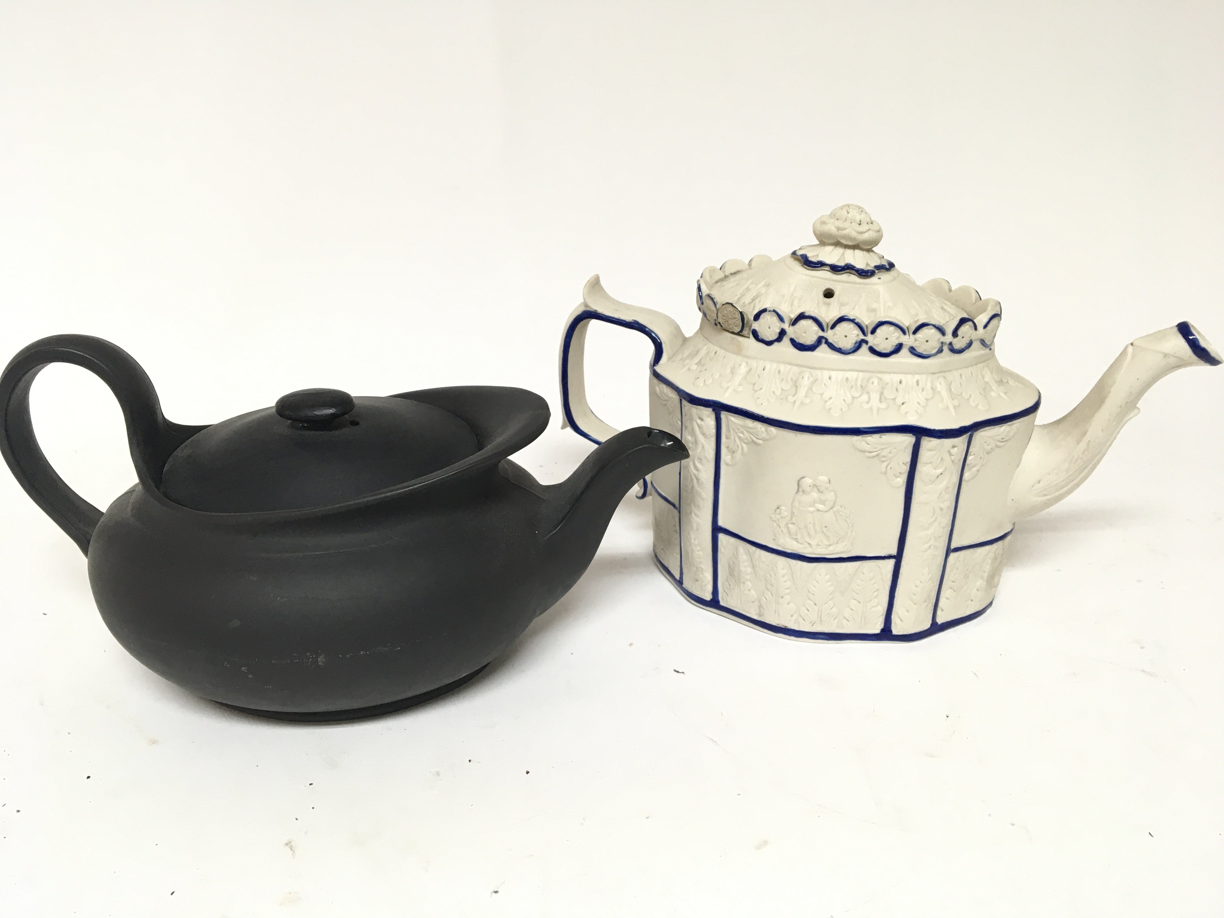 A Victorian moulded bisque type tea pot and Regenc
