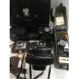 A collection of cameras and film equipment.