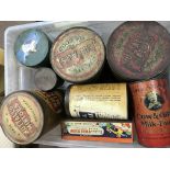 A box of old advertising tins .