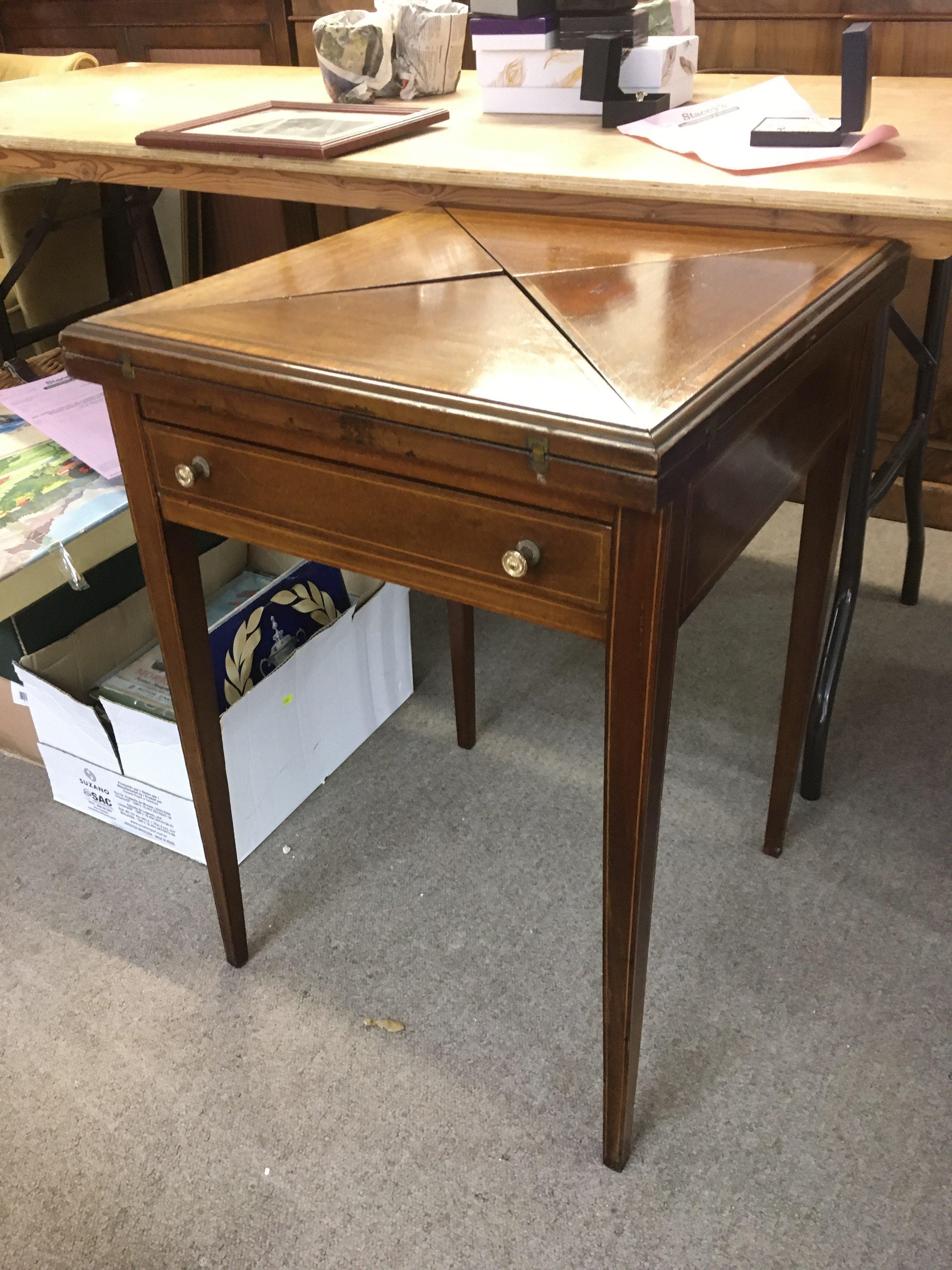 An Edwardian inlaid satin wood envelope card table