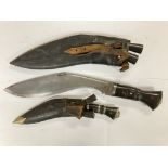 2 horn handled kukri knives..