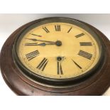 A mahogany case wall clock the circular dial with Roman numerals.