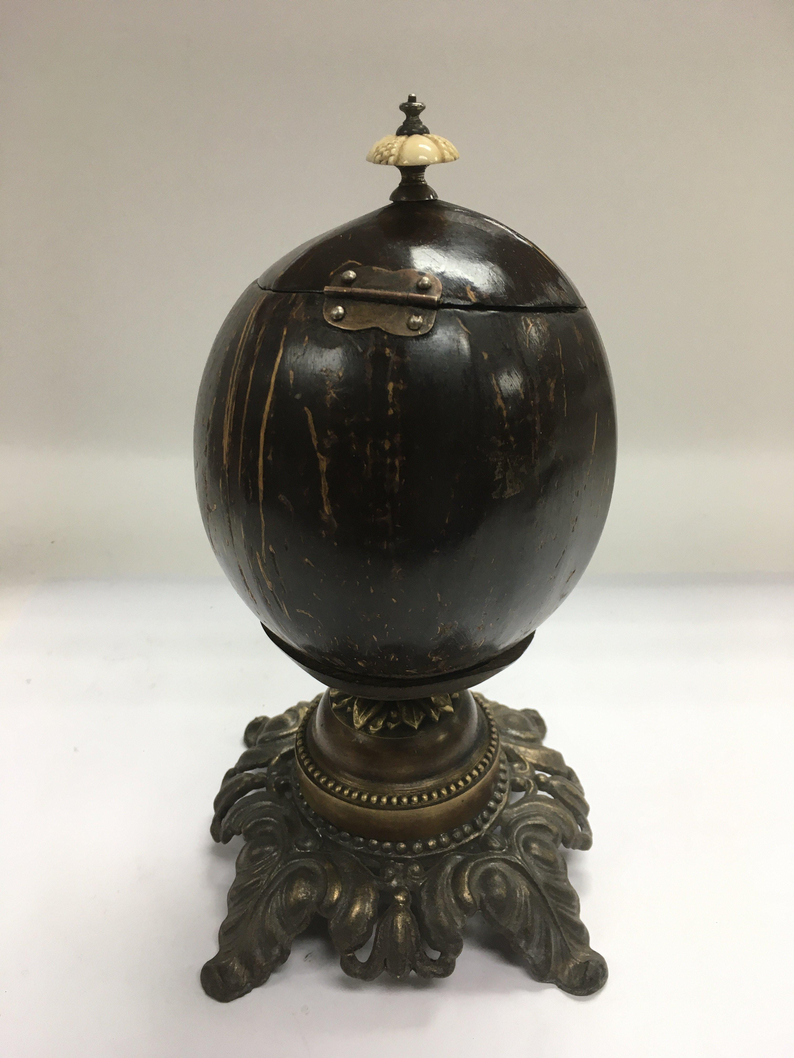 A Victorian polished coconut shell tea caddy raised on a metal base and with an ivory handle, approx - Image 2 of 3