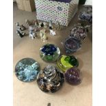 A Collection of paperweights and Wade figures.