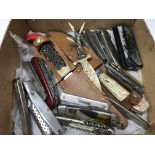 Quantity of small penknives and two sheath knives