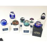 A collection of eight boxed Caithness paperweights some limited edition. (8)