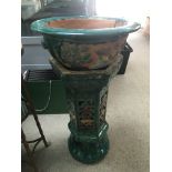 A Chinese planter on stand with a green painted fi