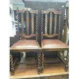 A set of four oak dining chairs with barley twist supports and drop in seats and Edwardian inlaid