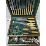 An oak cased canteen of cutlery.