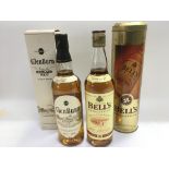 Two bottles of Whisky comprising a 70cl bottle of Bell's Extra Special and a 70cl bottle of Glenburn