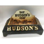 A cast iron Hudson's soap advertising drinking tro
