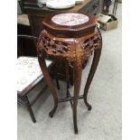 A carved bamboo jardiniere stand, the top inset wi