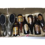 Six miniature Guinness and harp bottles and pair of metal shoe pin cushions