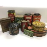 A collection of vintage tins including Ogden's jug