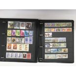 Seven albums of world postage stamps.