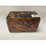 A small regency tortoishell veneered tea caddy wit