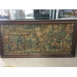 A 17th Century framed tapestry depicting figures in a woodland setting comprising a Lord and Lady