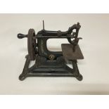 A vintage hand crank singer sewing machine.