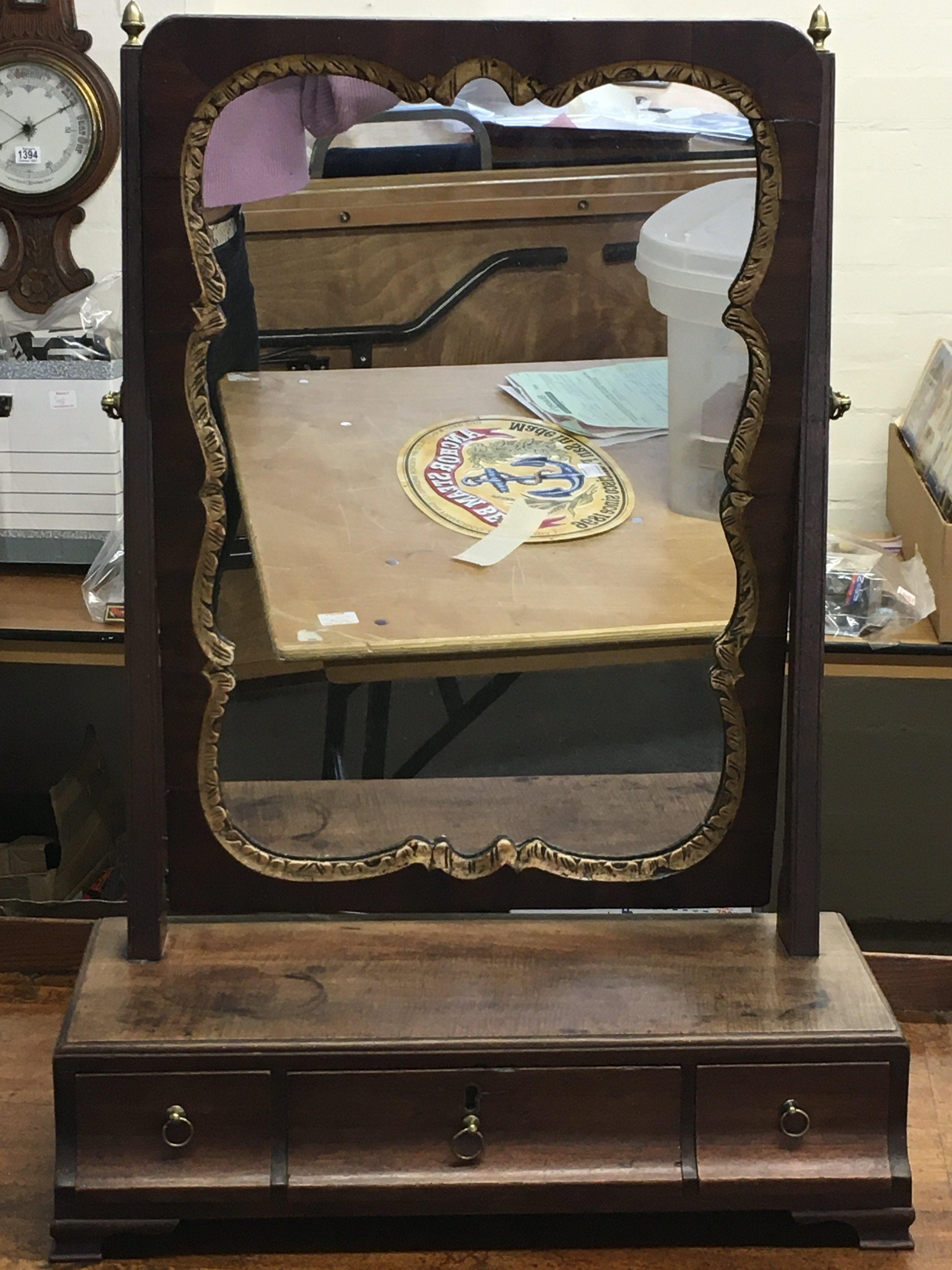 A small mahogany and gilt veneered table mirror wi