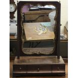 A small mahogany and gilt veneered table mirror wi