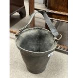 A Victorian leather fire bucket with copper rim an