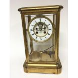 A gilt metal early 20th century four glass clock w