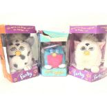 3 Boxed Furbys ( Boxes are warn.)