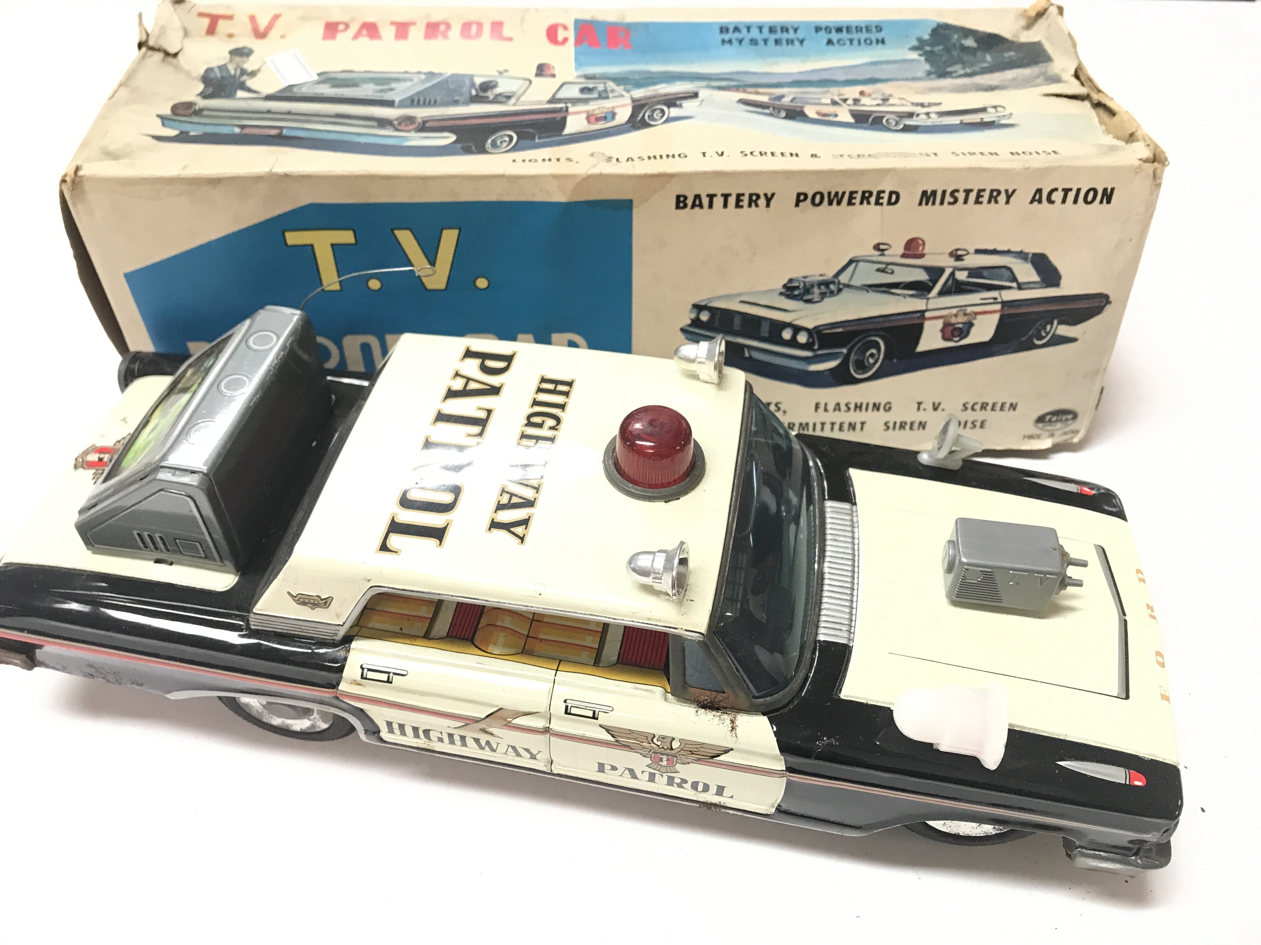 A Boxed T.V Patrol Car by Tiago. Box is Worn.