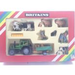 A boxed Britain�s Deutz Tractor and Farm Implement