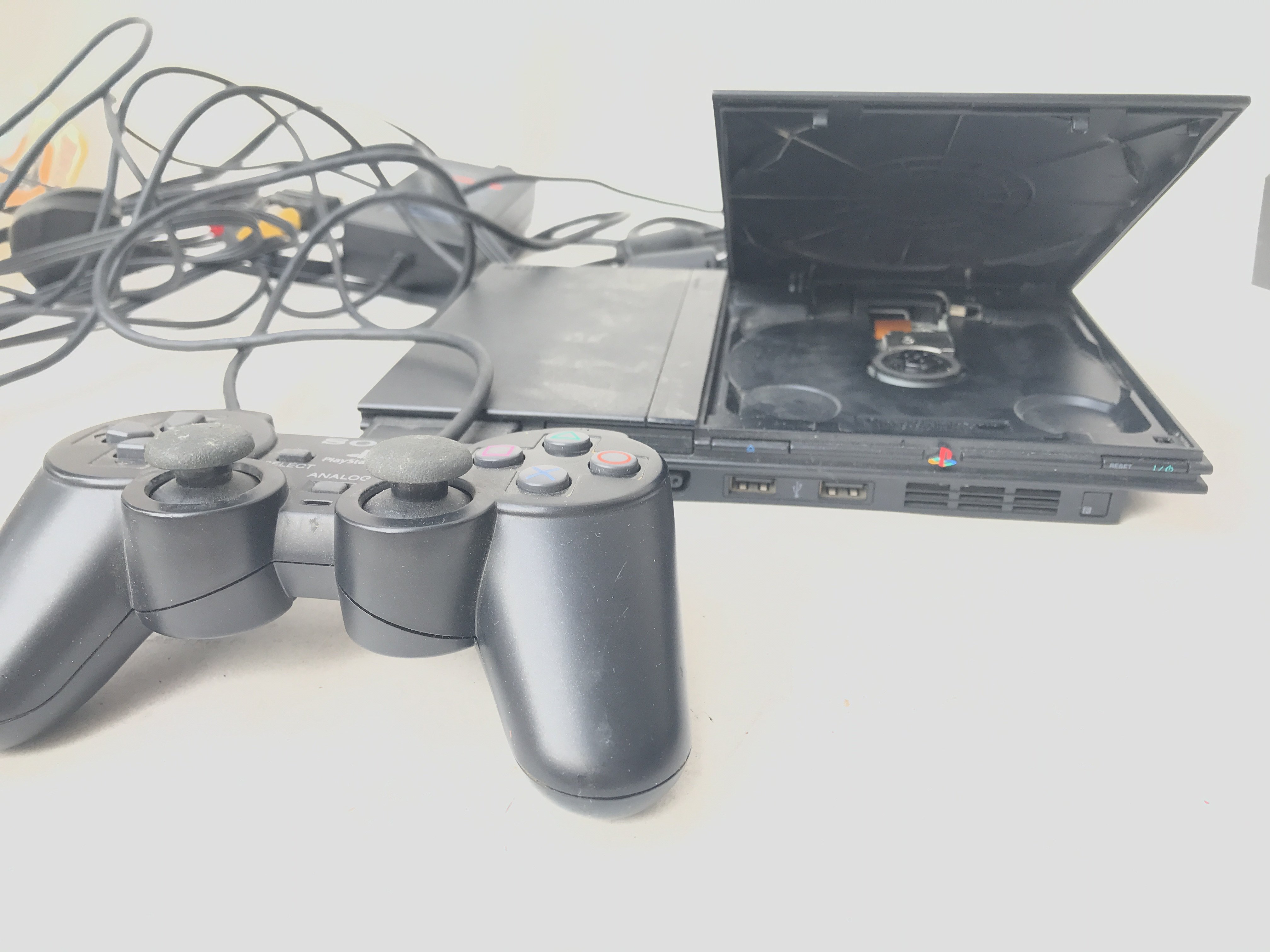 A PlayStation 2 Slim with Controller.and Memory Ca
