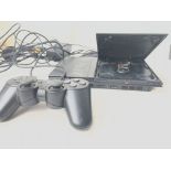 A PlayStation 2 Slim with Controller.and Memory Ca