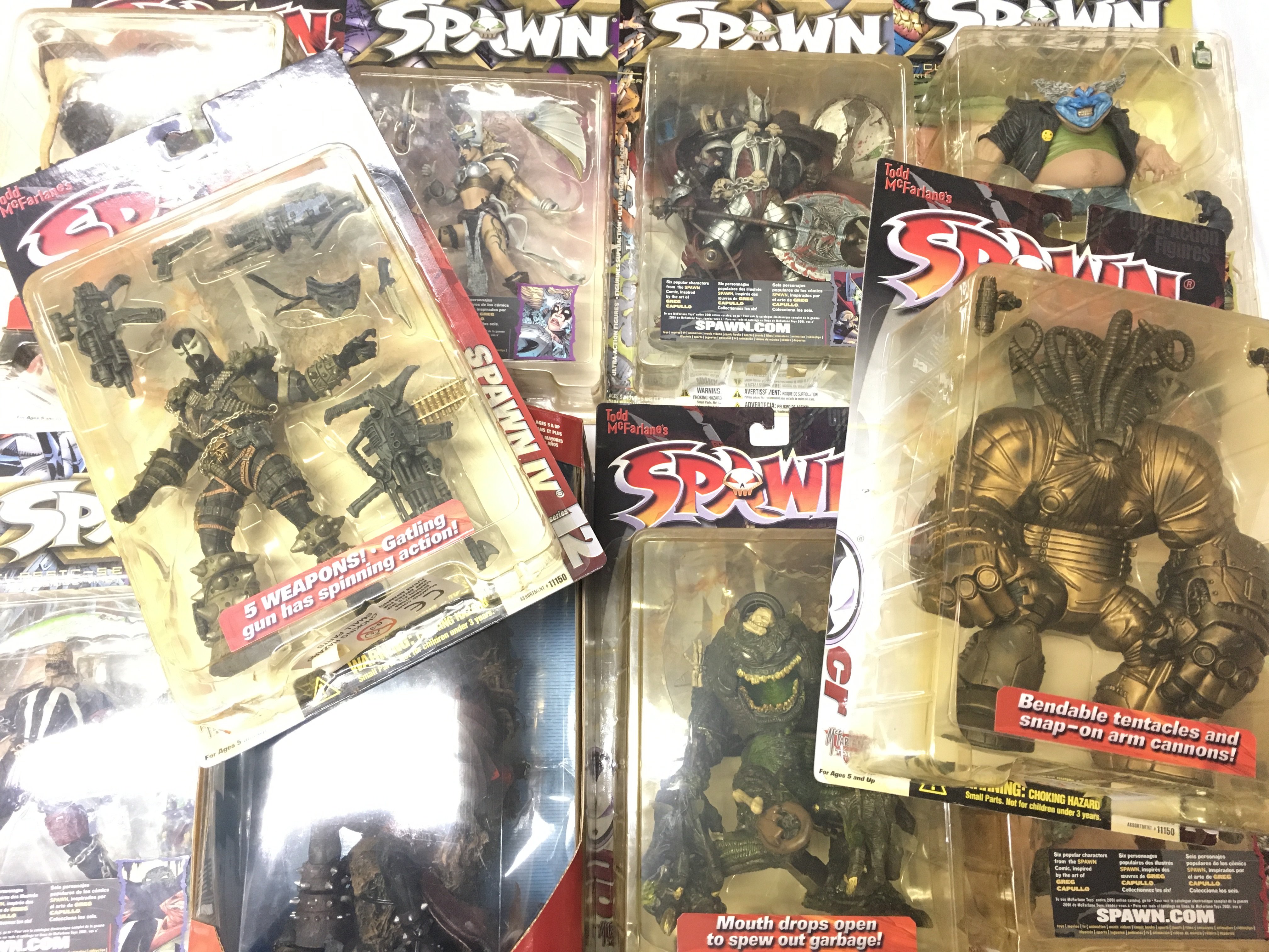 A Box Containing A Collection Of Spawn Figures by McFarlane Toys.