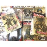 A Box Containing A Collection Of Spawn Figures by McFarlane Toys.