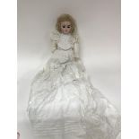 A German bisque doll with the markings 1900-0.