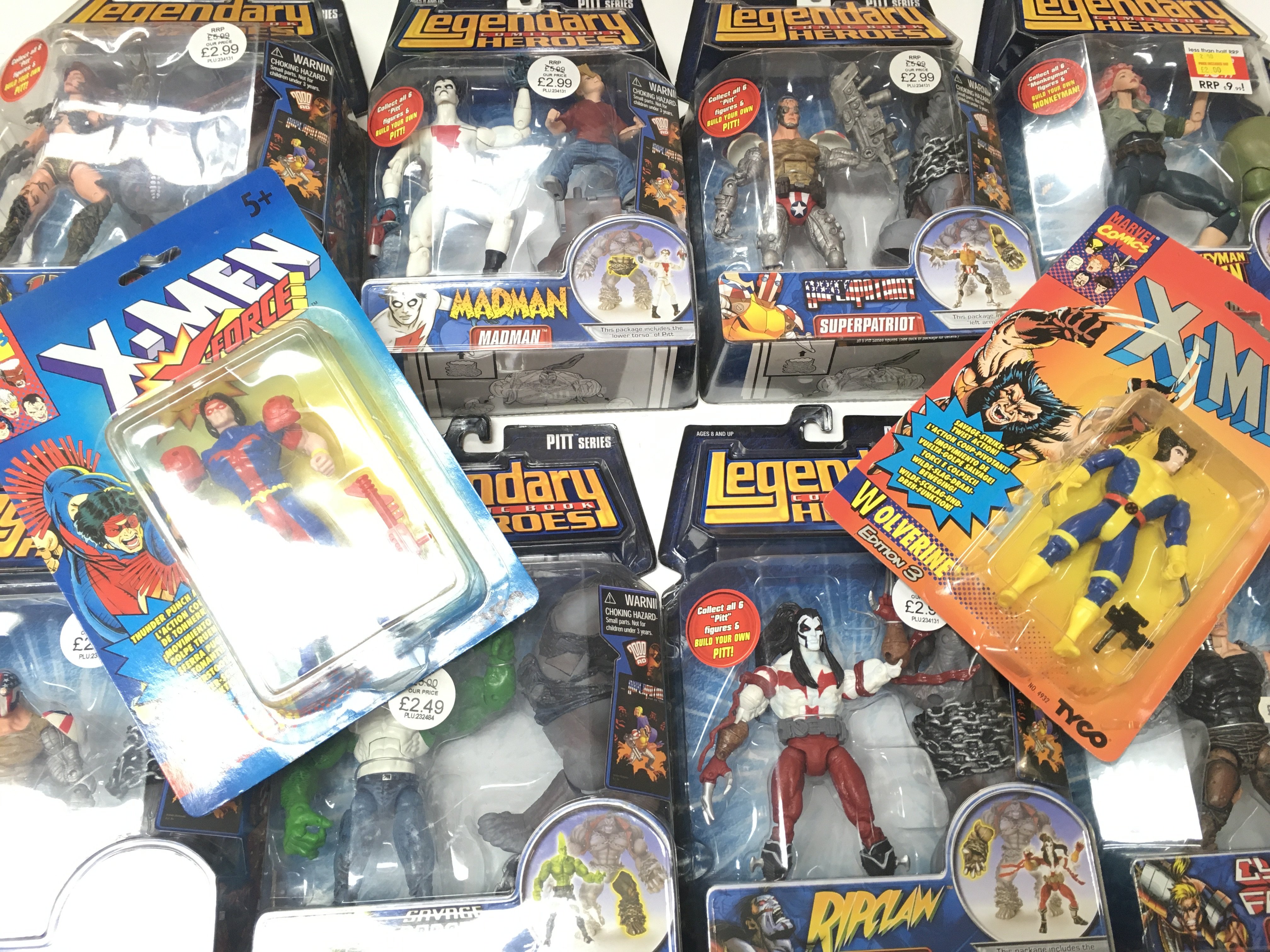 A Box Containing a Collection of Legendary Comic Book Hero Figures. X-Men and Judge Dredd.