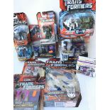A Collection of Carded Transformers by Hasbro.
