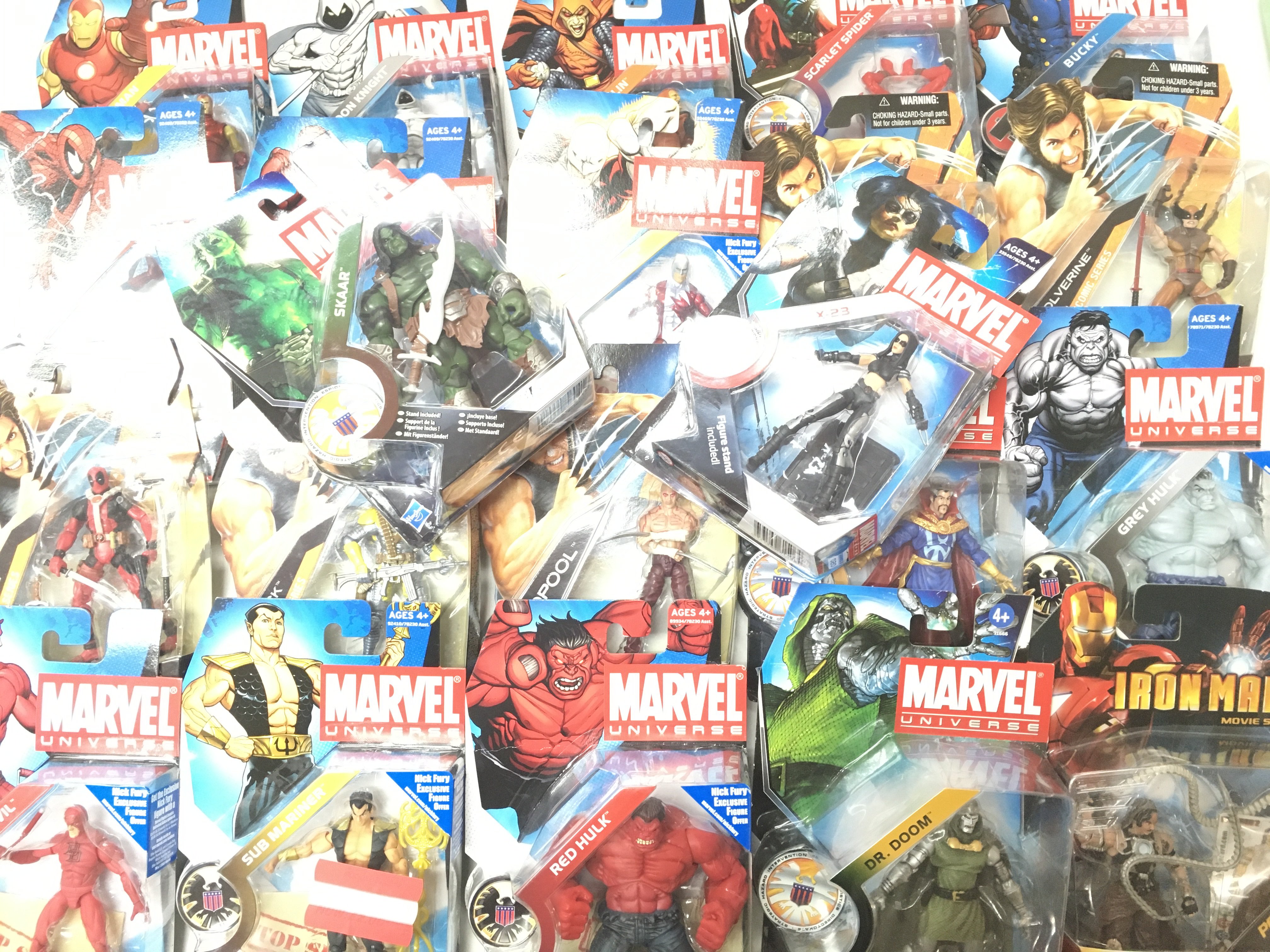 A Box Containing a Collection of Marvel Universe Figures and Super Hero Figures. All Carded.