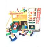 A Fisher Price Action Garage Play Set with Accesso