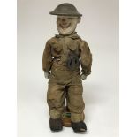 A rare military doll on a stand with Canadian Forestry Corps badge.