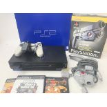 A Boxed PlayStation 2 With Games and a Light gun.(