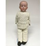 A German bisque boy figure, inscribed on the reverse with number 4.