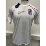 Michael Owen Signed England Football Shirt: White large home shirt with tags signed to front clearly