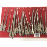 A good collection of Antique silver handled button hooks of various design.