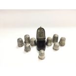 Nine silver thimbles including two by Charles Horner.