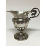 A German silver cream jug. The approximate weight