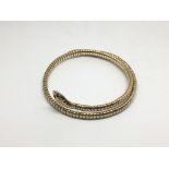 A 9ct gold snake bangle, approx 20g.