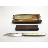 A boxed Georgian silver penknife and a cased chero